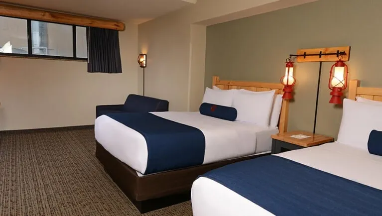 The two queen beds in the accessible Gray Wolf Suite