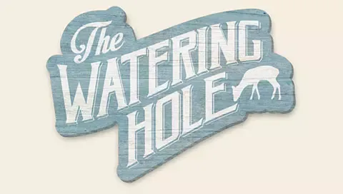 The logo for The Watering Hole at Great Wolf Lodge indoor water park and resort.