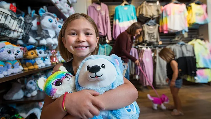  A small girl shopping at Buckhorn Exchange at Great Wolf Lodge indoor water park and resort.