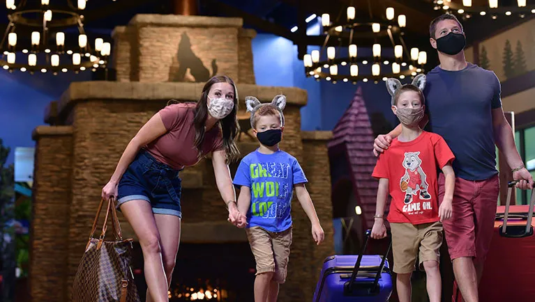 family arriving at Great Wolf Lodge