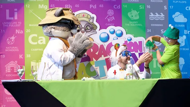 Wiley the Wolf and friends perform science experiments during the Interaction Reaction event