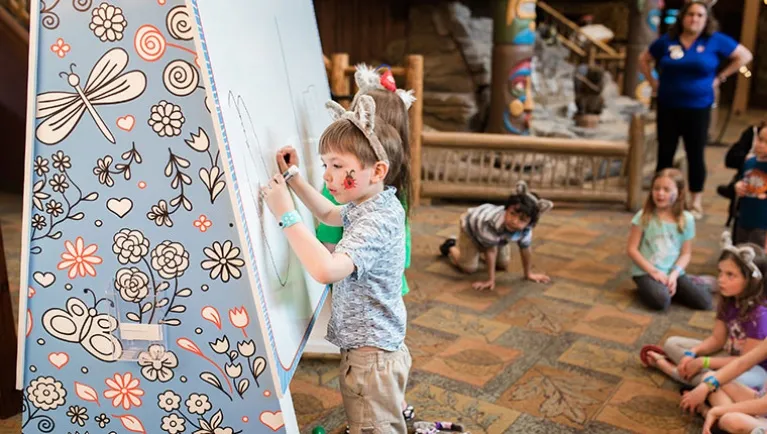 A boy draws during an event at Great Wolf Lodge indoor water park and resort.