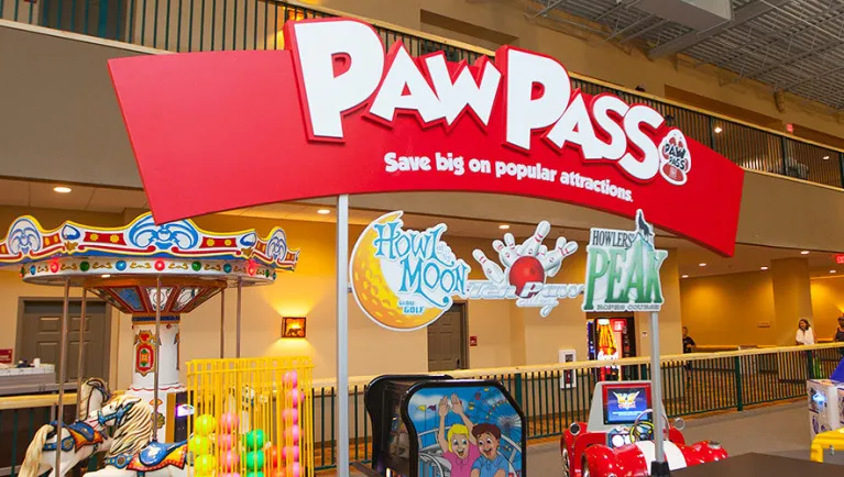 A Paw Pass sign at Howlin Timbers Play Park at Great Wolf Lodge indoor water park and resort.