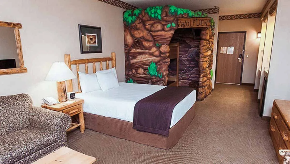 The bed and den in the Wolf Den Suite  (Resort View)